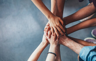 Close,Up,Top,View,Of,Young,People,Putting,Their,Hands