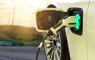 Electric,Car,Or,Ev,Car,Charging,In,Station,On,Blurred