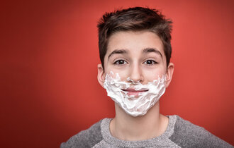 Smiling,Young,Boy,With,Shaving,Foam,On,His,Face