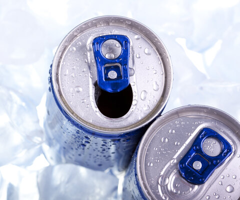 Closeup,Of,Blue,Drink,Can,On,Ice,Background