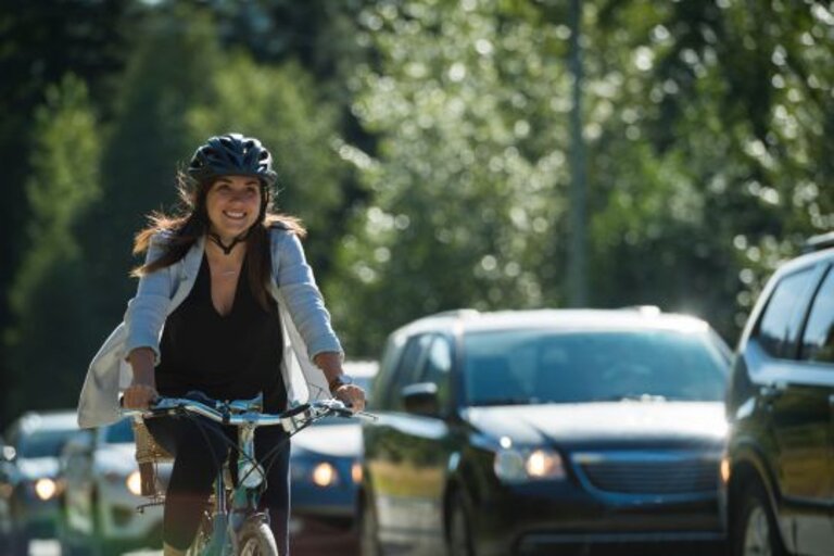 Woman commuting in a cycling lane