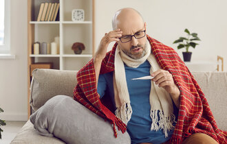 Upset,Sick,Middle-aged,Caucasian,Man,Sit,In,Blanket,Feel,Unwell
