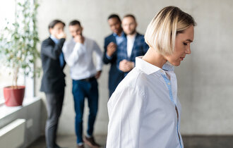 Workplace,Bullying,And,Sexism.,Male,Colleagues,Whispering,Behind,Back,Of