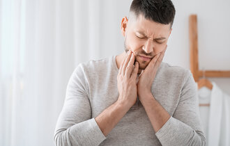 Man,Suffering,From,Tooth,Ache,In,Morning