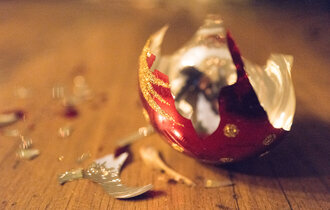 Broken Christmas bauble on floor