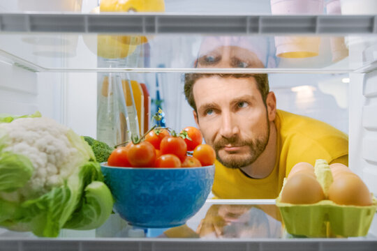 Inside,Kitchen,Fridge:,Young,Disappointed,Man,Looks,Inside,The,Fridge.